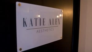 Katie Alex Aesthetics Logo on a door