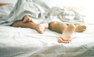 A couple lying in bed together