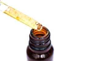 dropping vitamin c liquid into a jar